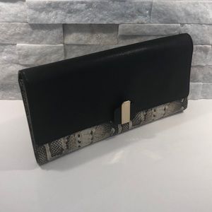 Henri bendel flap clutch